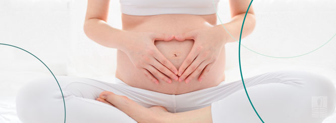 Pregnant woman surrounded by balloons