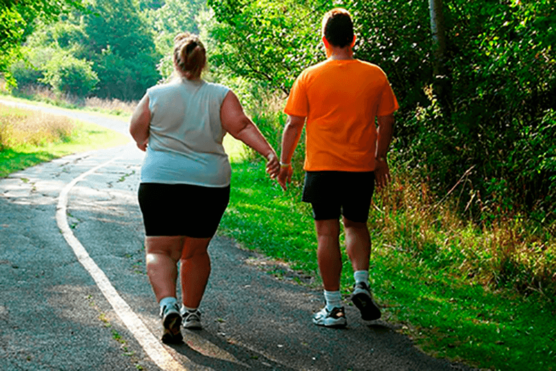 Couple walking down a country road